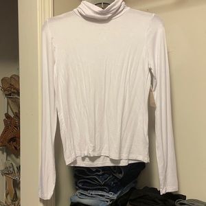 So, super soft white turtleneck, size S.